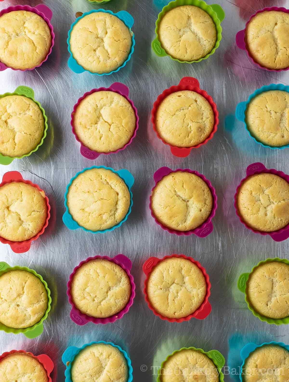 Freshly baked mochi muffins on a pan.