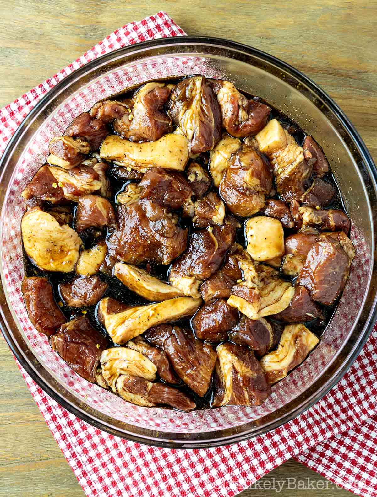 Filipino pork barbecue marinating in a bowl.