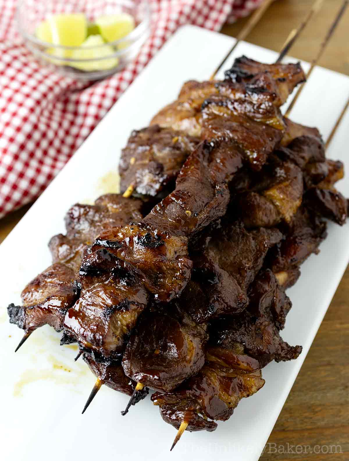 Freshly grilled Filipino pork barbecue on a plate.