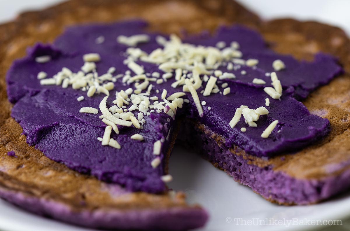 Filipino ube pancake topped with ube butter and shredded coconut.