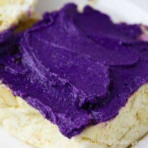 Creamy ube butter spread on pandesal.