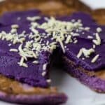 Ube pancake topped with ube butter and coconut.