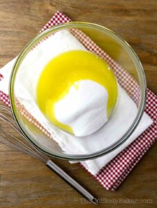 Melted butter and sugar in a bowl.