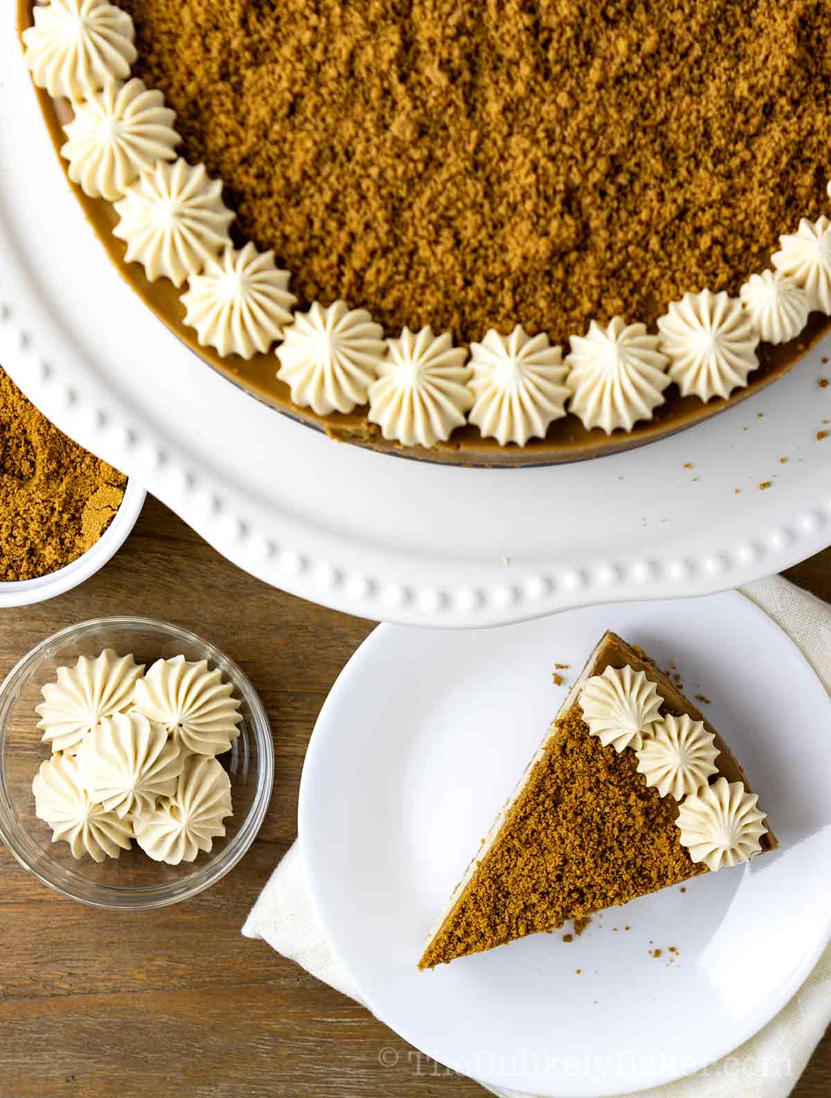 Overhead shot of Biscoff cheesecake with cookie crumbs.