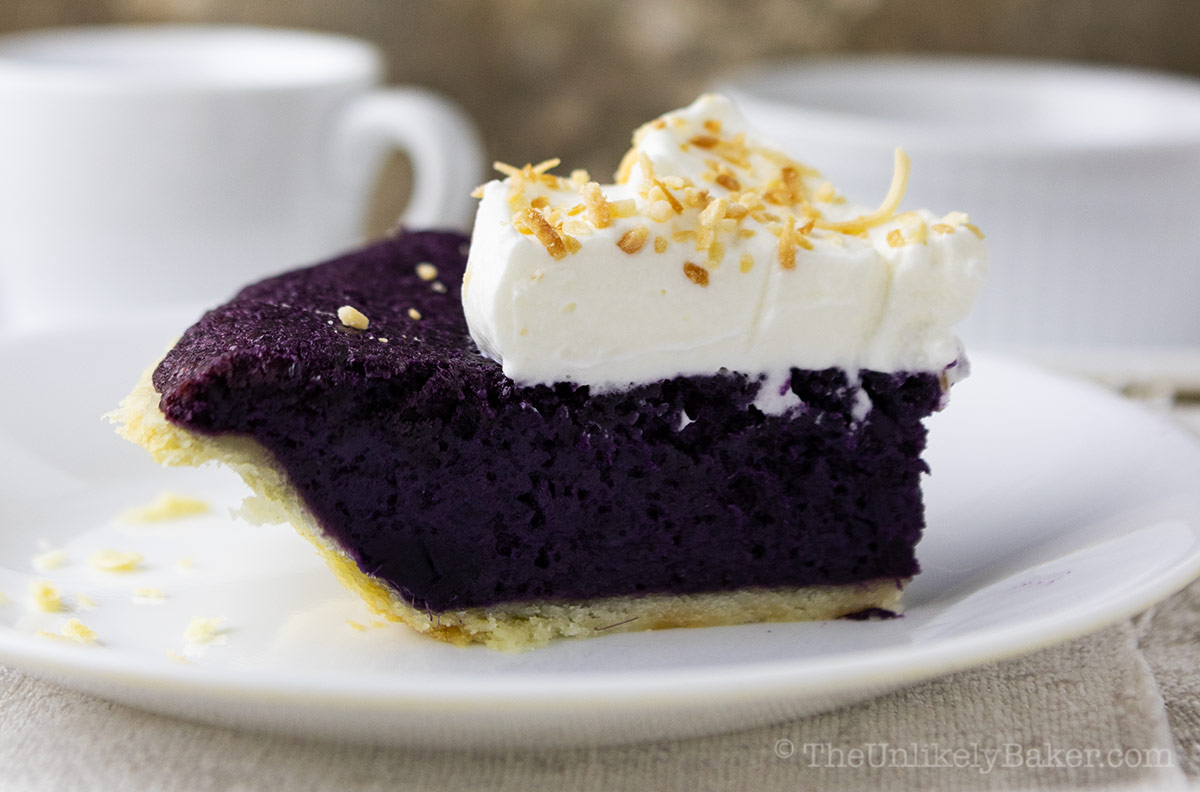 A slice of purple yam pie on a plate.