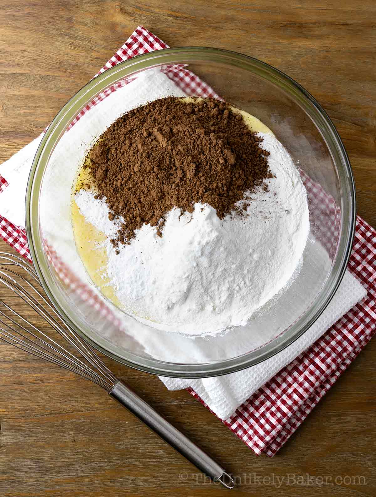 Glutinous rice flour and cocoa powder added to wet ingredients.