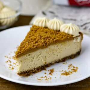 A slice of Biscoff cheesecake on a plate.