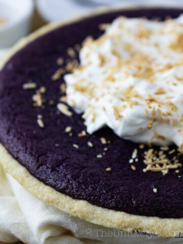 Ube pie with whipped coconut cream topping.