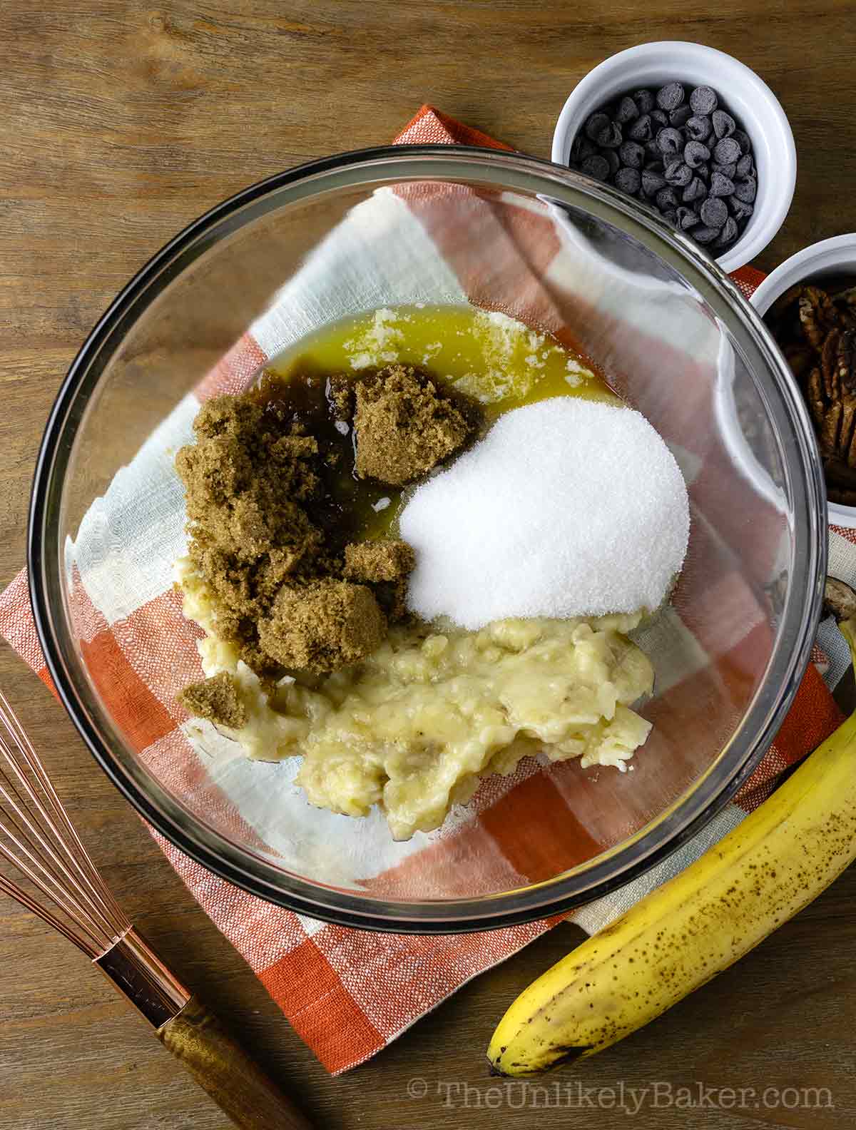 Mashed bananas and sugar in a bowl.