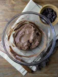 Chocolate ganache with whipped cream in a bowl.