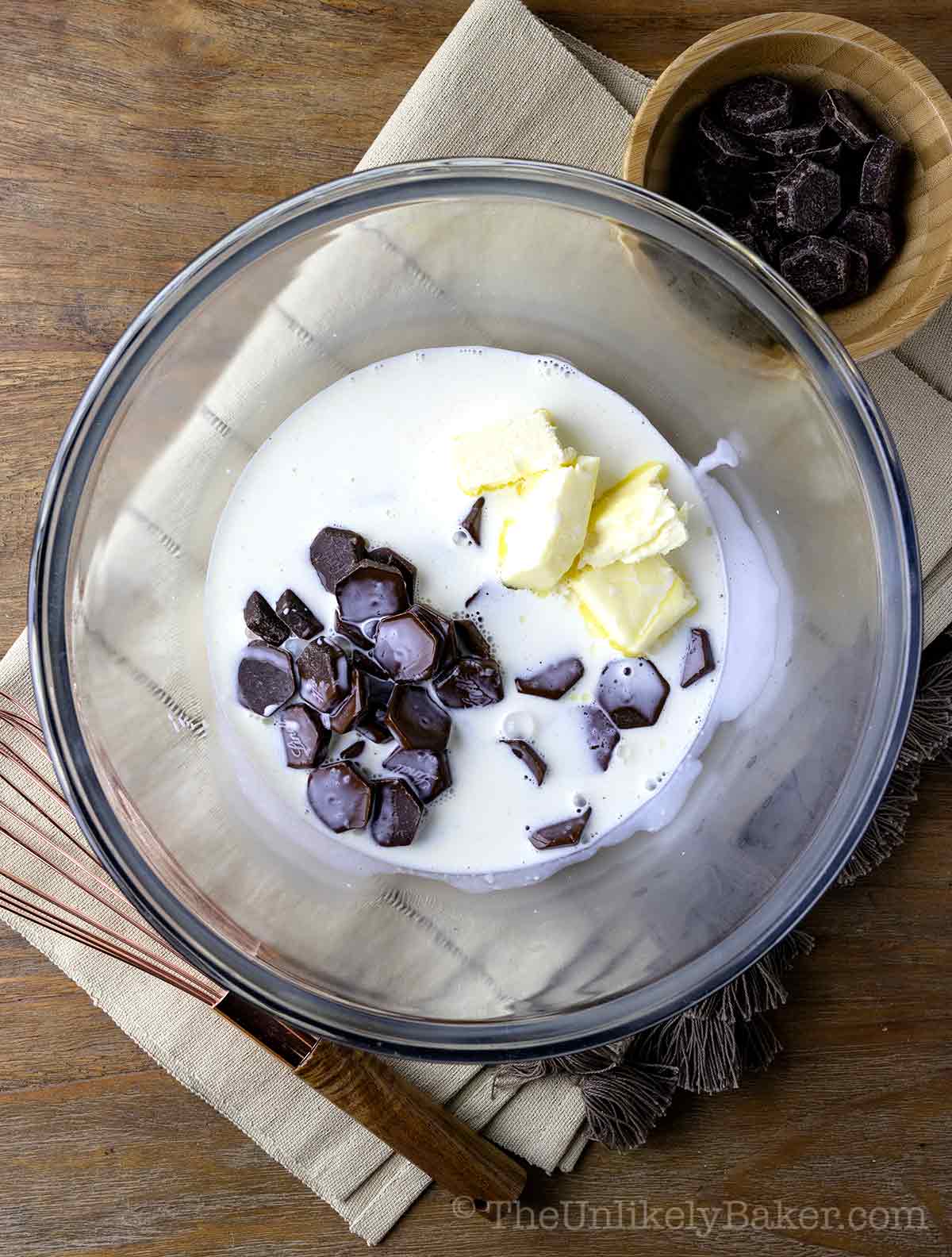 Butter chocolate and cream in a bowl.