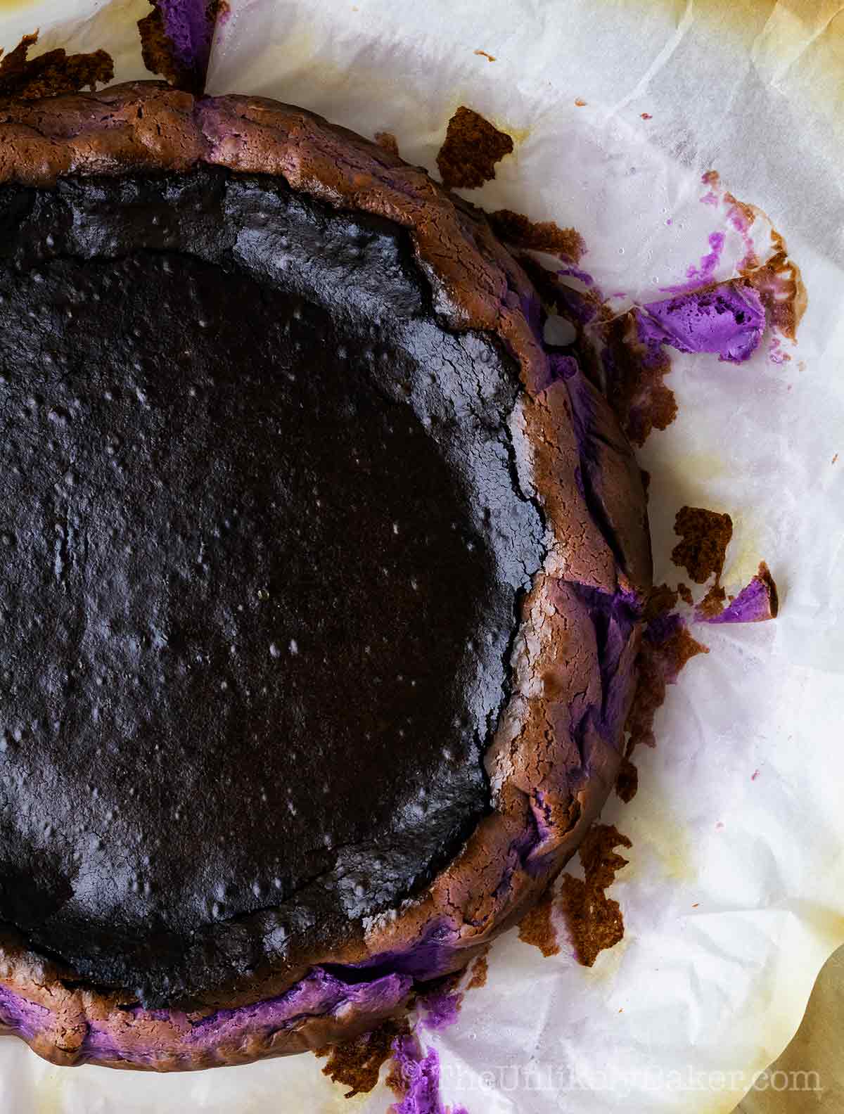 Overhead shot of freshly baked basque cheesecake flavored with ube.