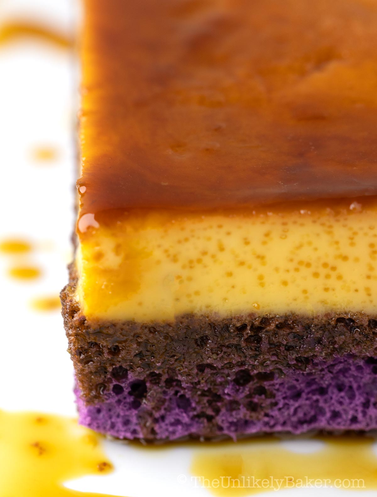 Freshly baked ube flan cake on a platter.