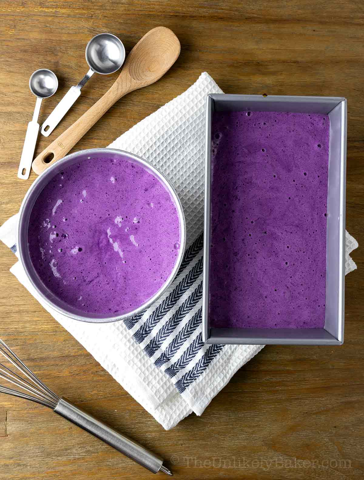 Cake batter in pans.