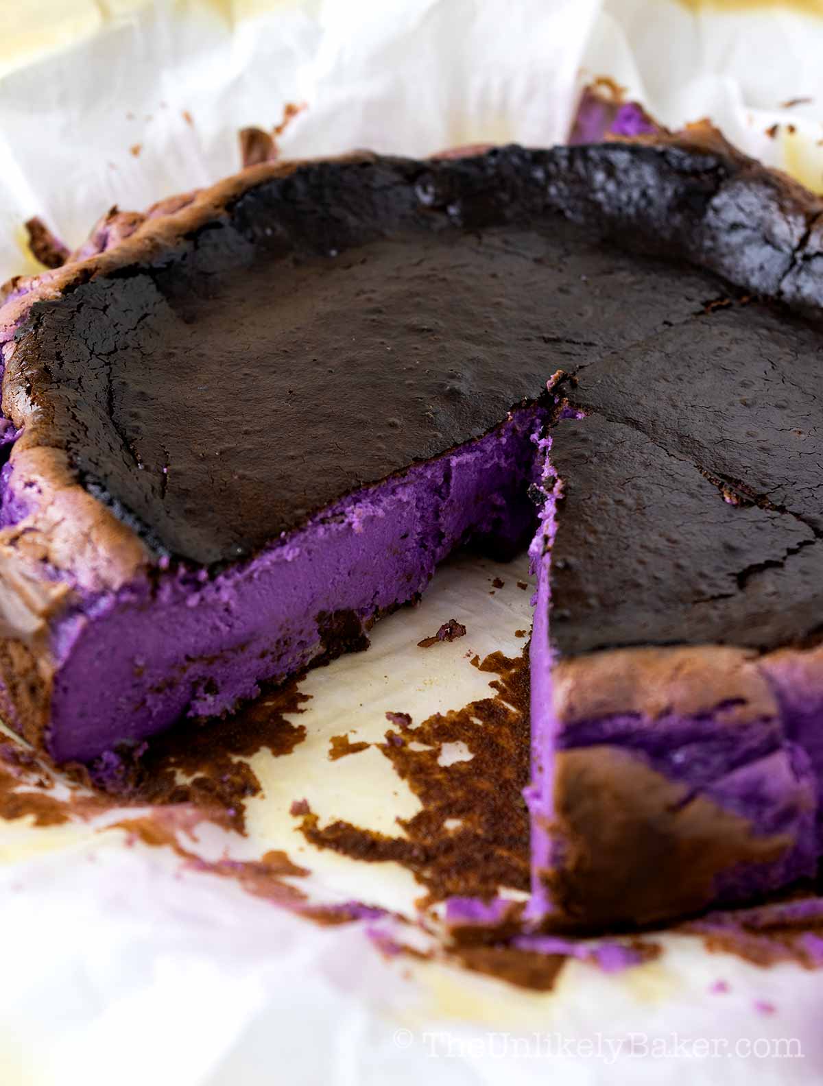 A whole ube basque burnt cheesecake showing the vibrant purple filling.