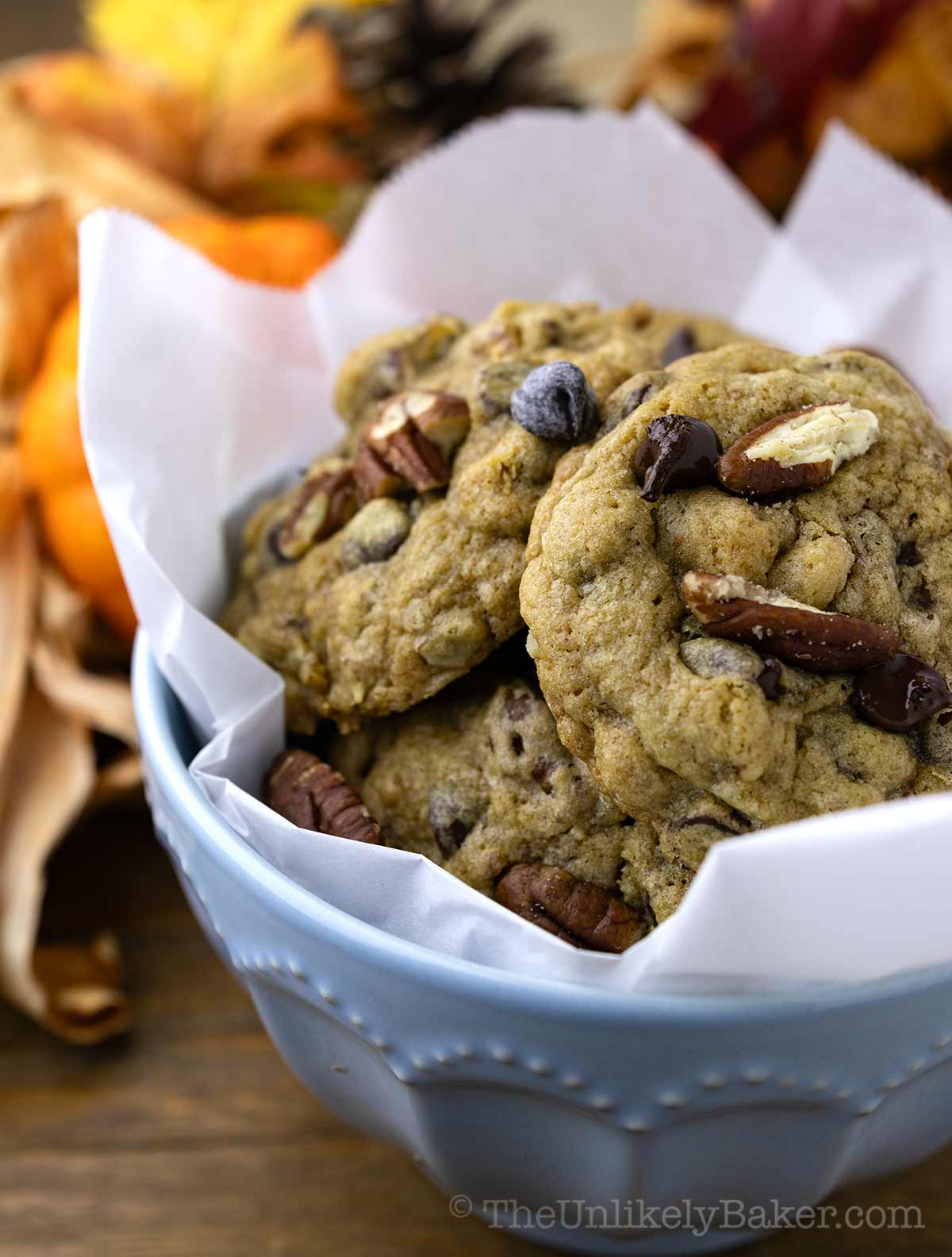 Chewy chocolate chip and pecan cookies in a bowl.