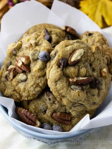 Chocolate chip pecan cookies in a serving bowl.