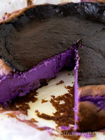 Basque cheesecake showing the vibrant purple ube filling.