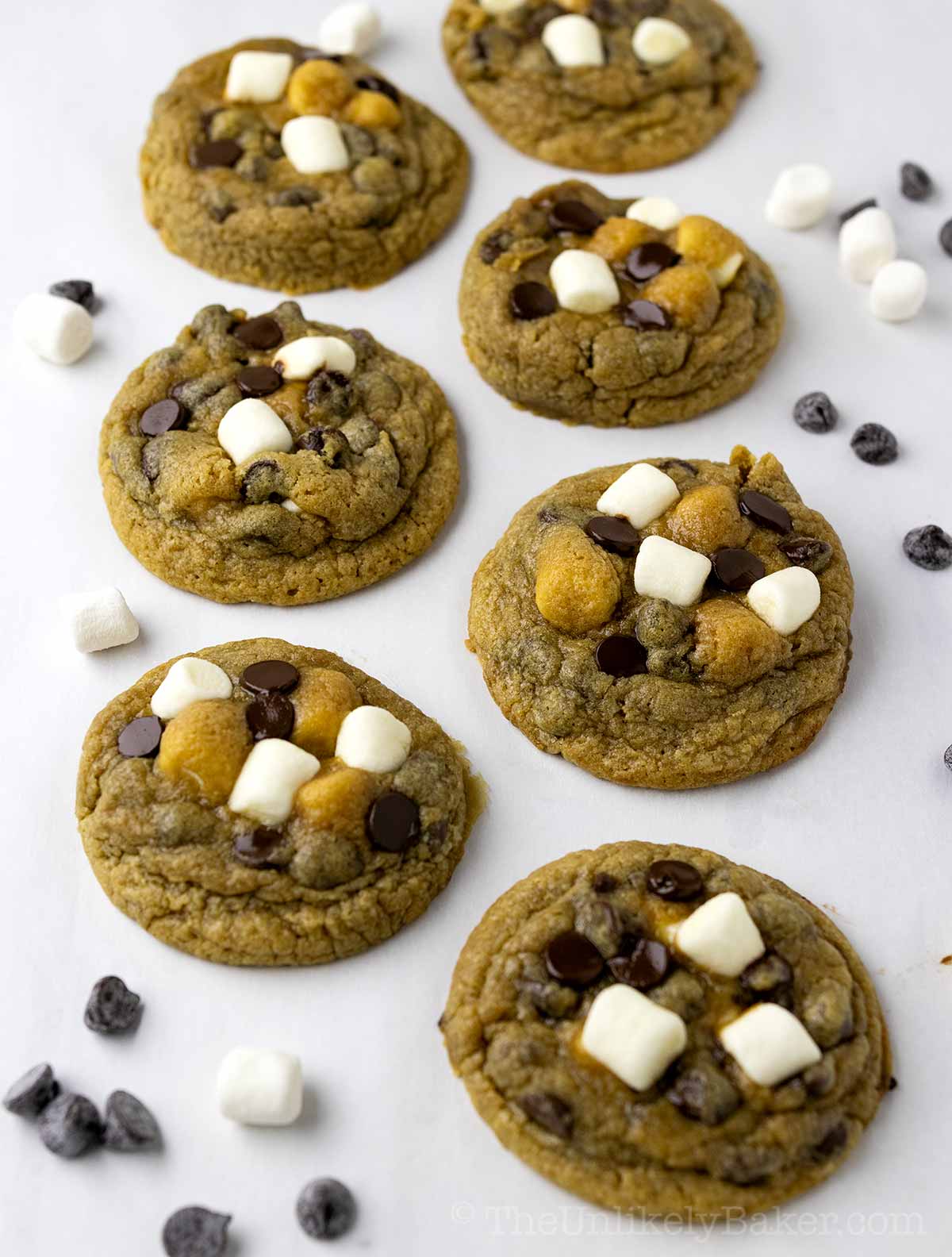 Chocolate chip and marshmallow cookies on a baking pan.