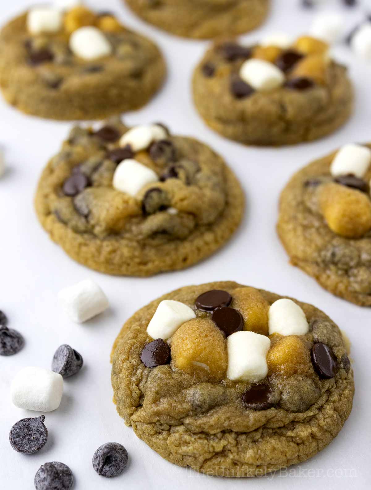 Chocolate chip marshmallow cookies on a baking sheet.