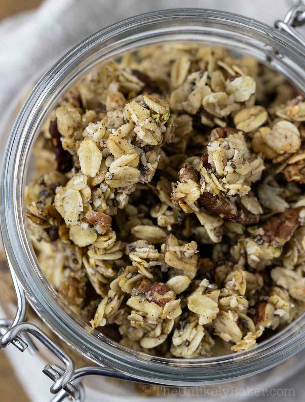 Homemade granola with pecans in a jar.