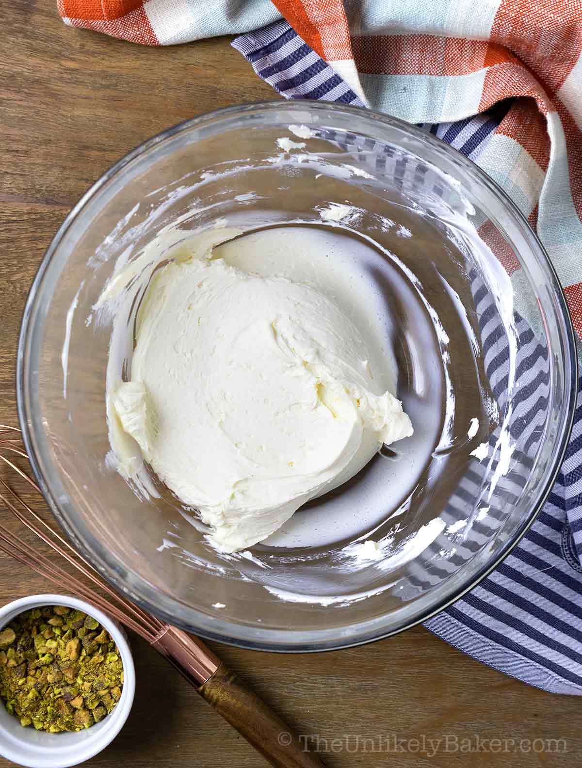 Beaten cream cheese in a bowl.