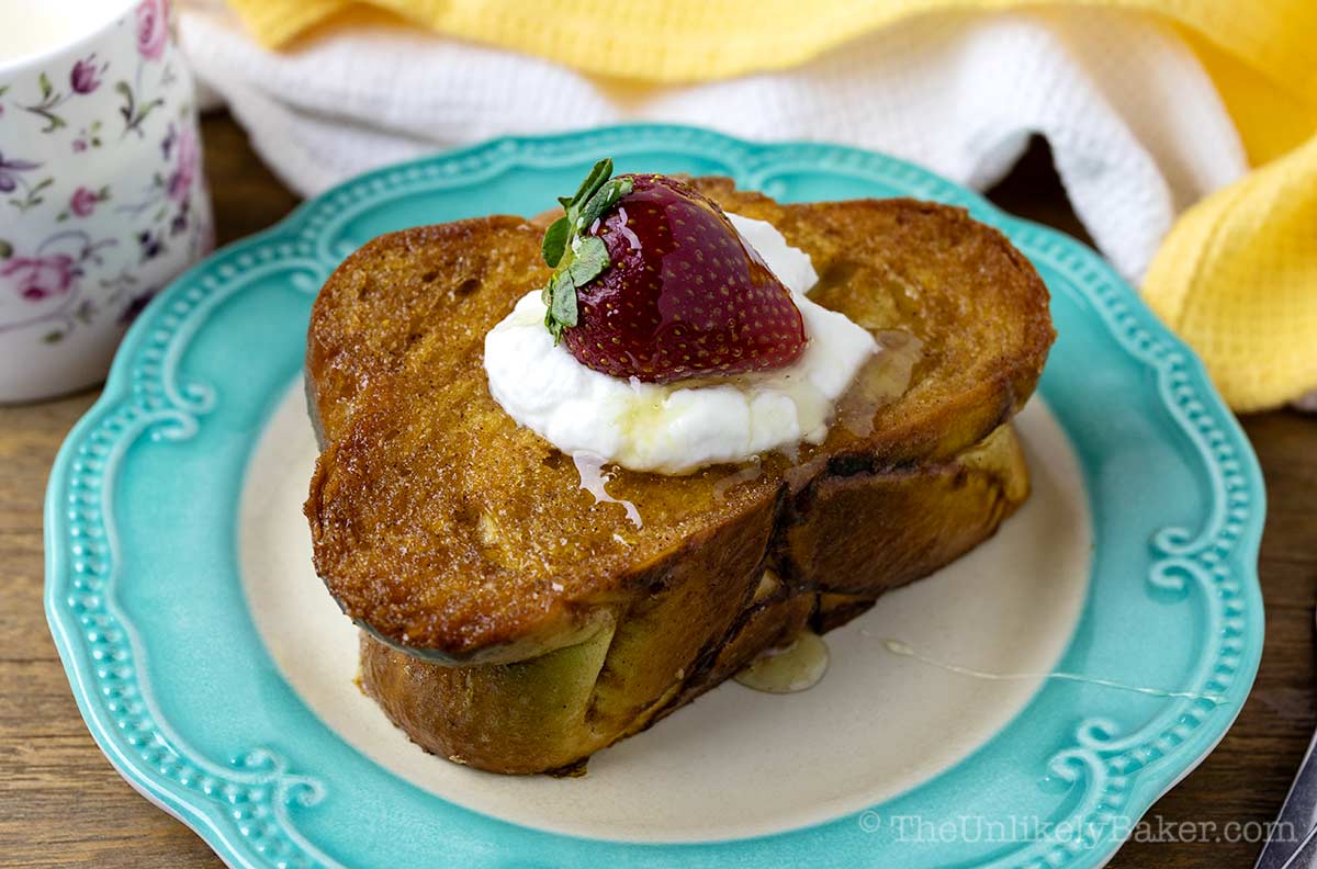 Butter and honey toast on a plate.