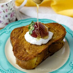 Honey butter toast topped with yogurt and strawberry.