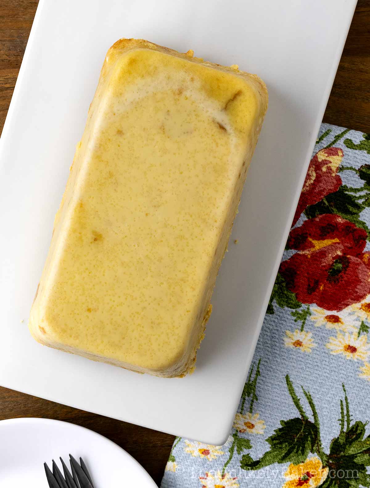 Freshly baked bread pudding on a serving platter.