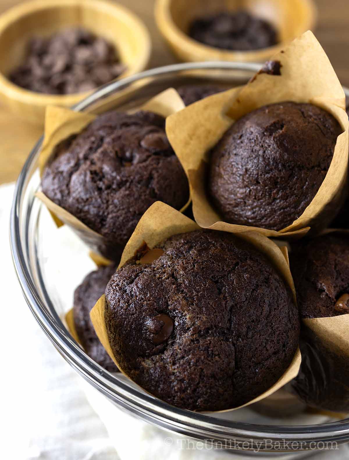 Triple chocolate muffins in a bowl.