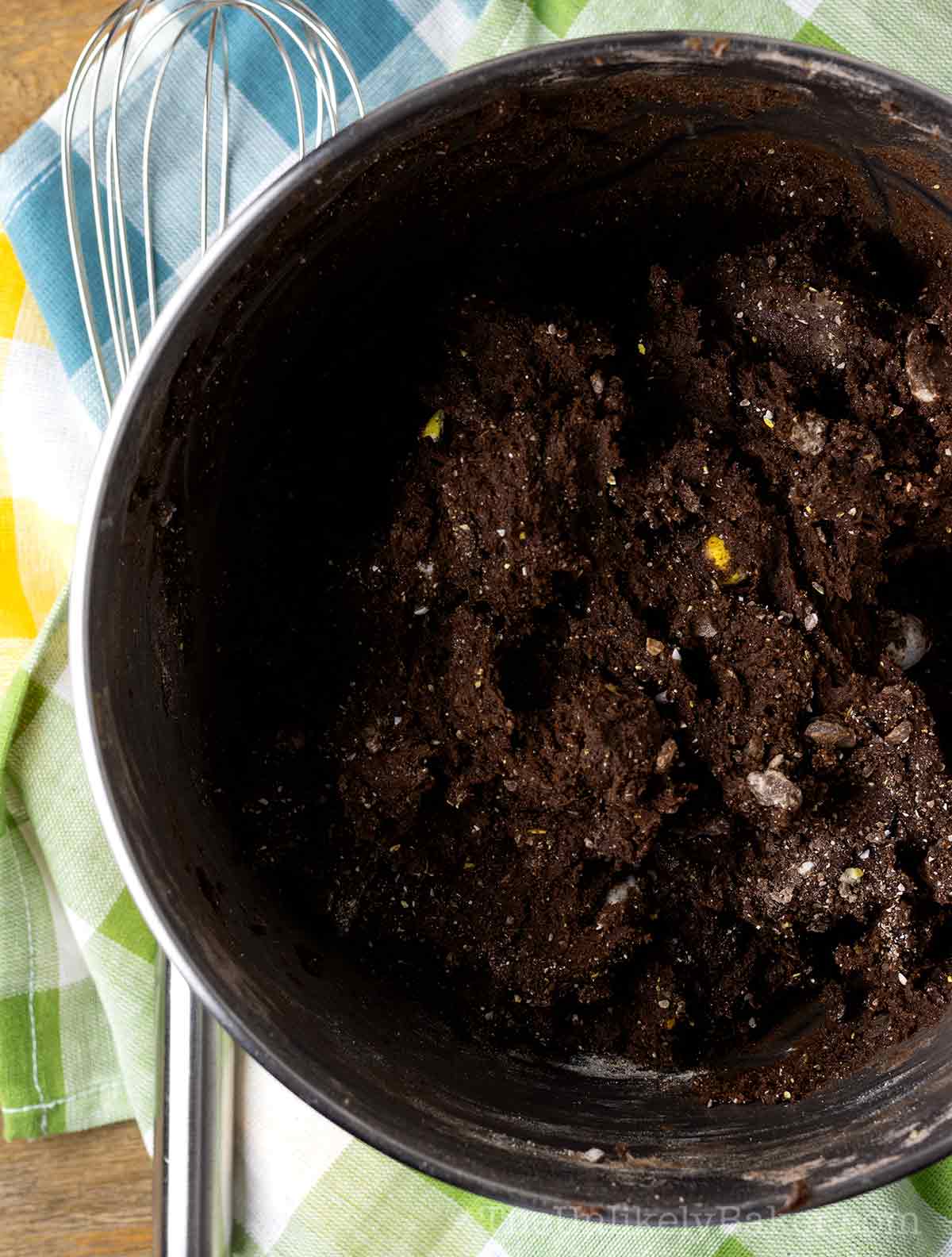 Chocolate mini eggs cookie dough in a bowl.