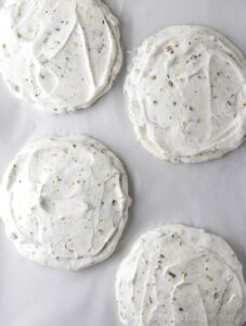 Pistachio meringue piped on baking pan.