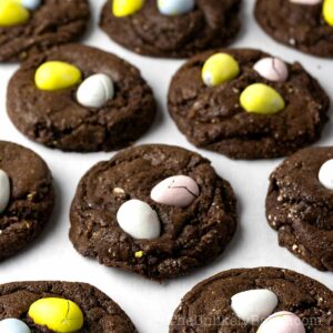 Freshly baked mini egg cookies on a pan.