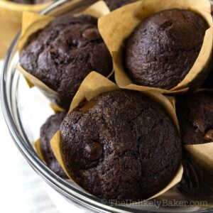 Triple chocolate muffins in a bowl.