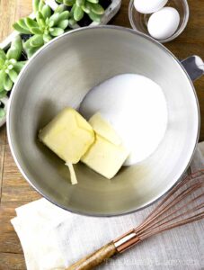 Butter and sugar in a bowl.