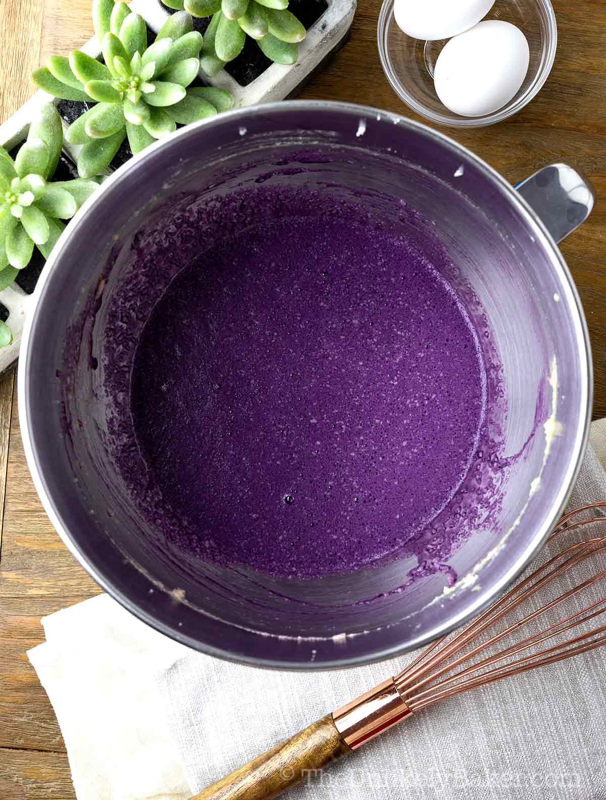 Ube wet ingredients in a bowl.