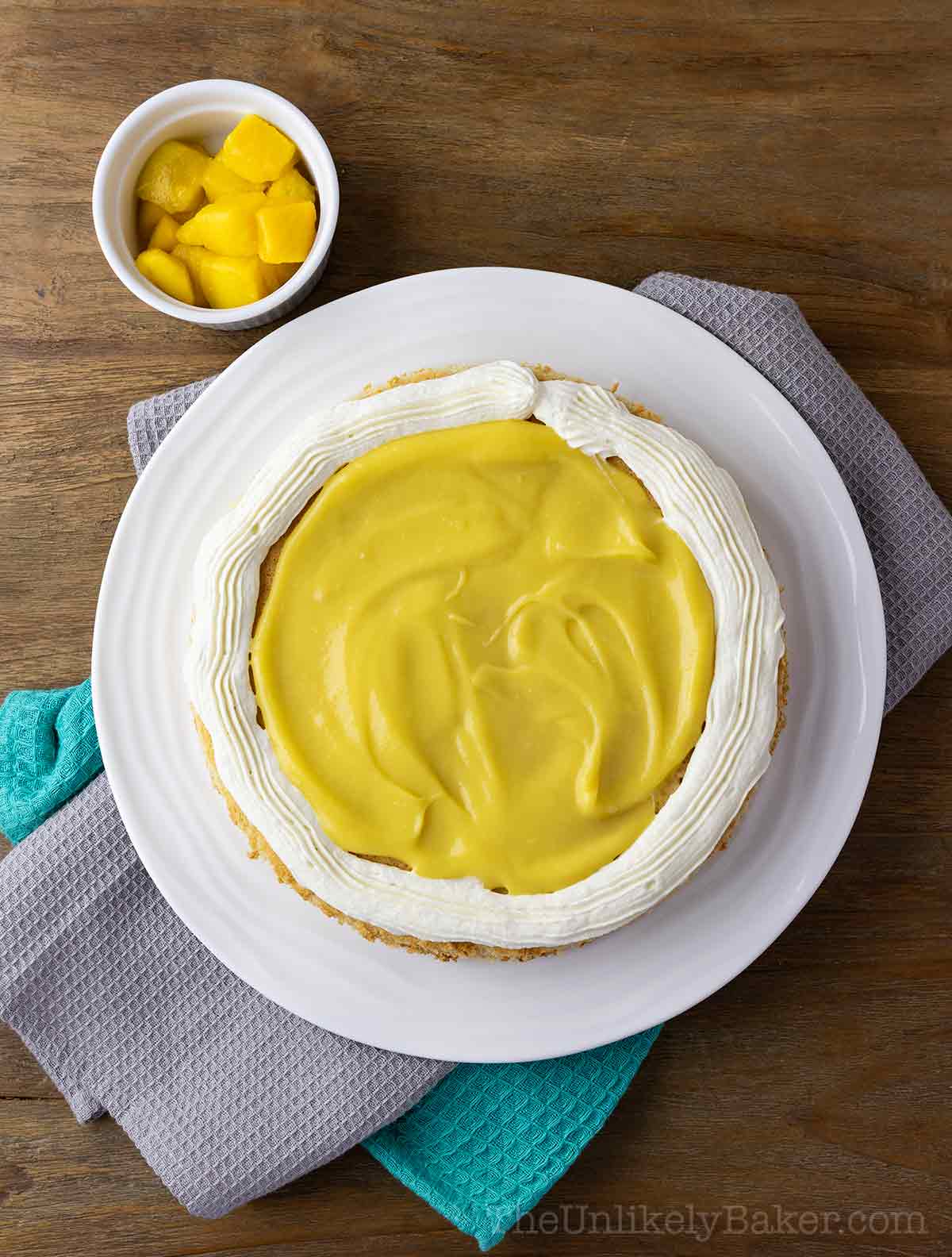 Frosting dam with mango curd in the middle.