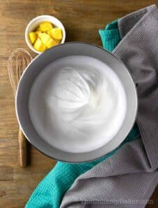 Egg whites whipped to stiff peaks.