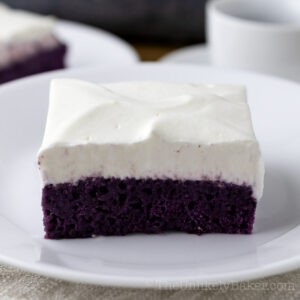 A slice of ube tres leches cake.