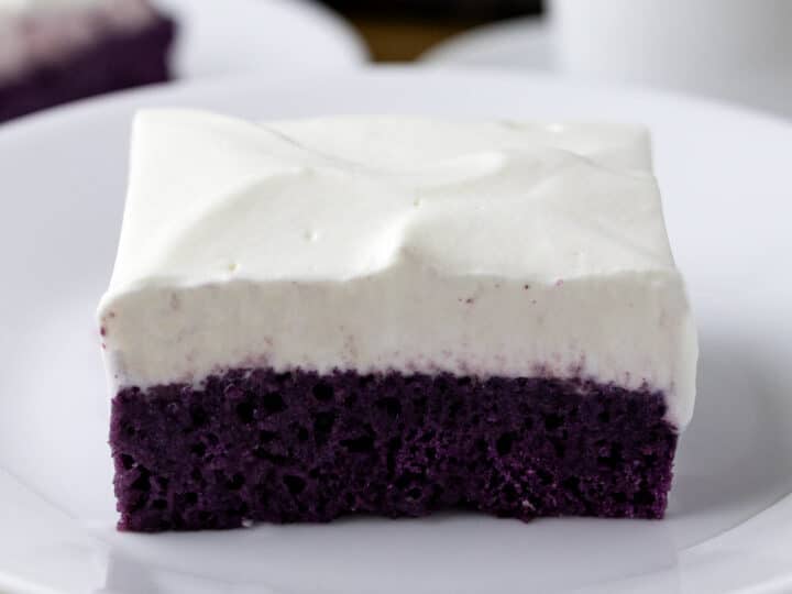 A slice of ube tres leches cake.