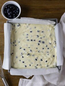 Blueberry cheesecake filling in a pan.