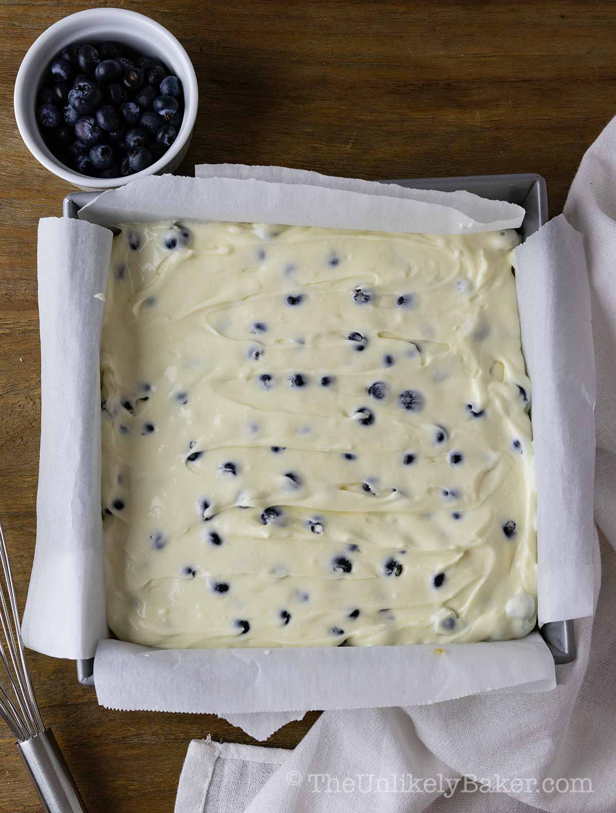 Blueberry cheesecake filling in a pan.