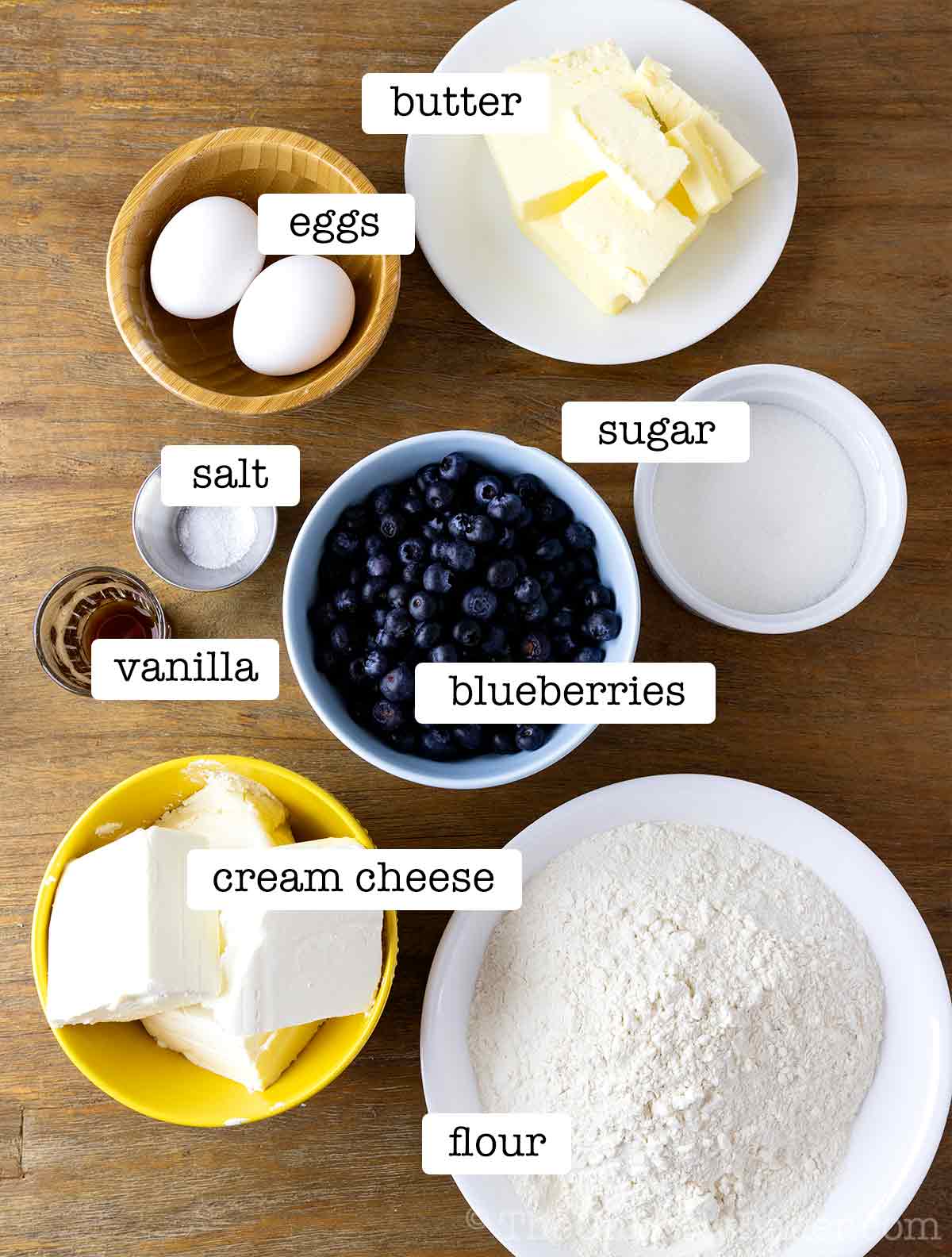 Ingredients for blueberry cream cheese bars with text overlay.