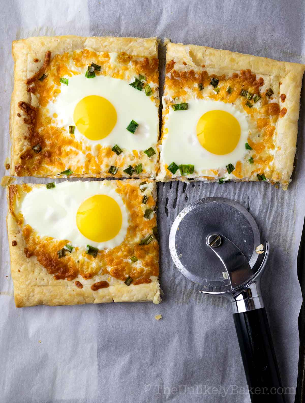Eggs in puff pasty sliced with a pizza cutter.