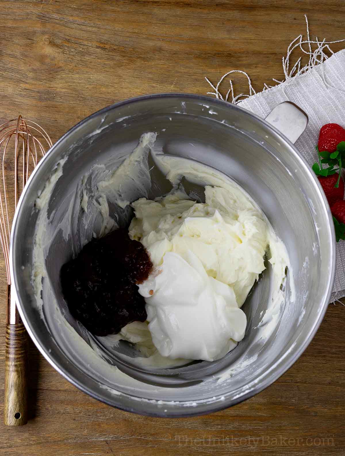 Strawberry jam and sour cream added to cream cheese.