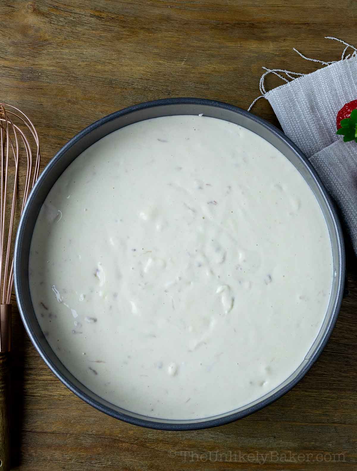 Cheesecake filling in a pan.