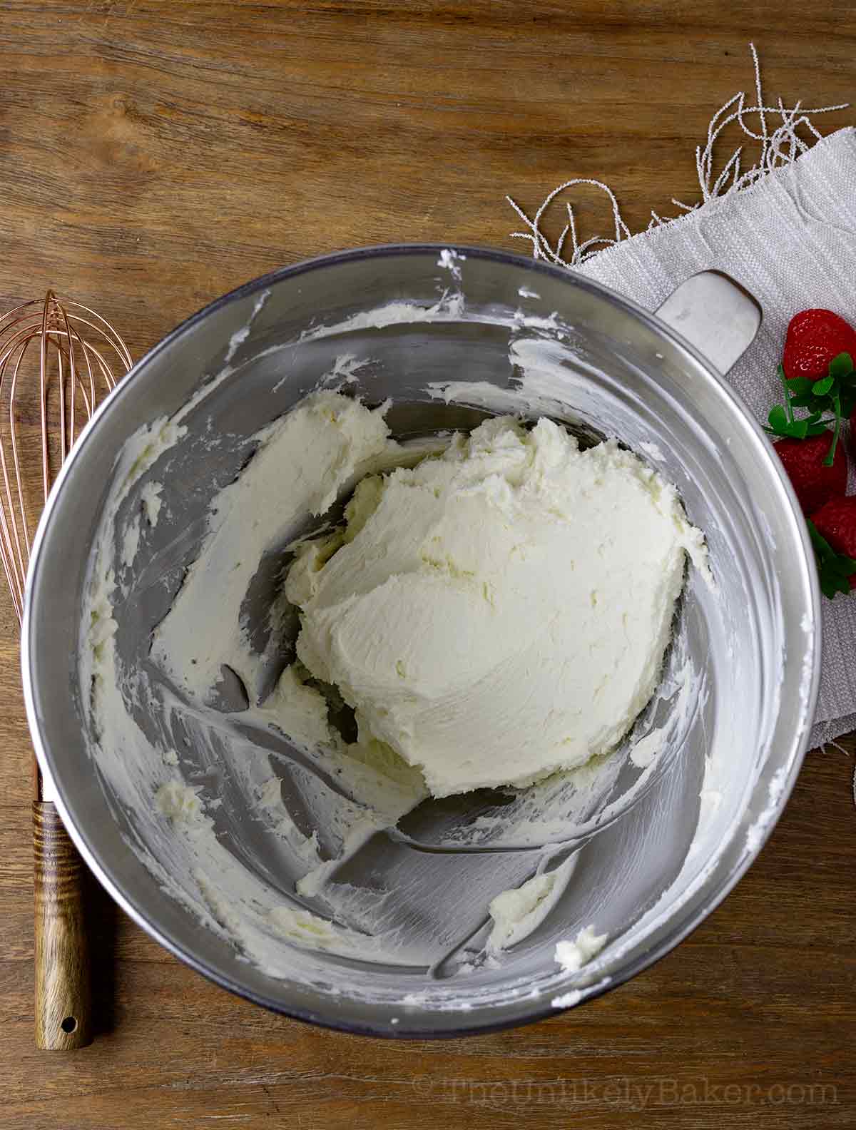 Beaten cream cheese in a bowl.