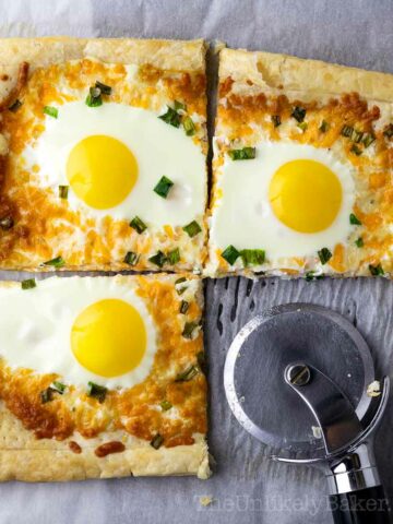 Eggs in puff pastry sliced with a pizza cutter.