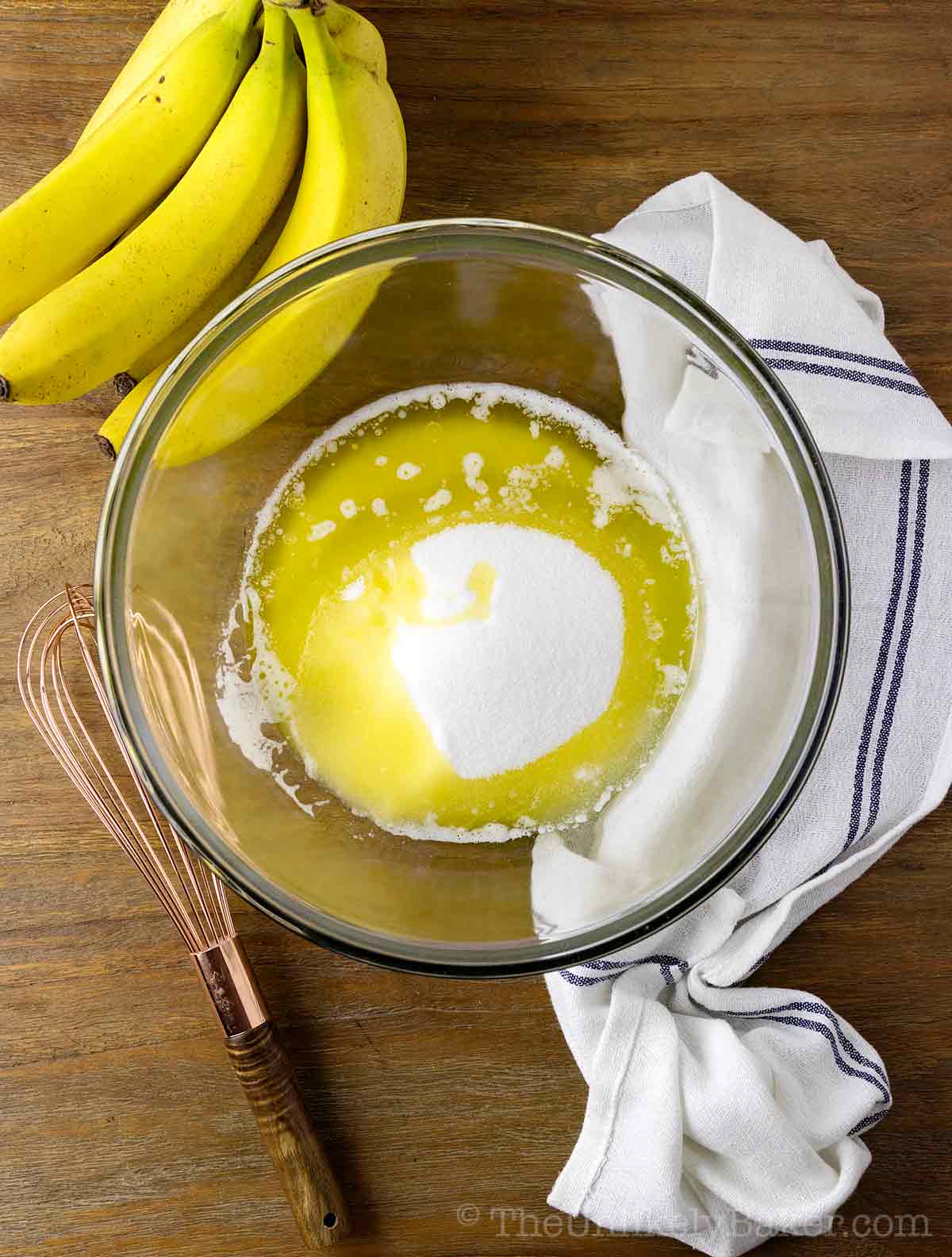 Melted butter and sugar in a bowl.