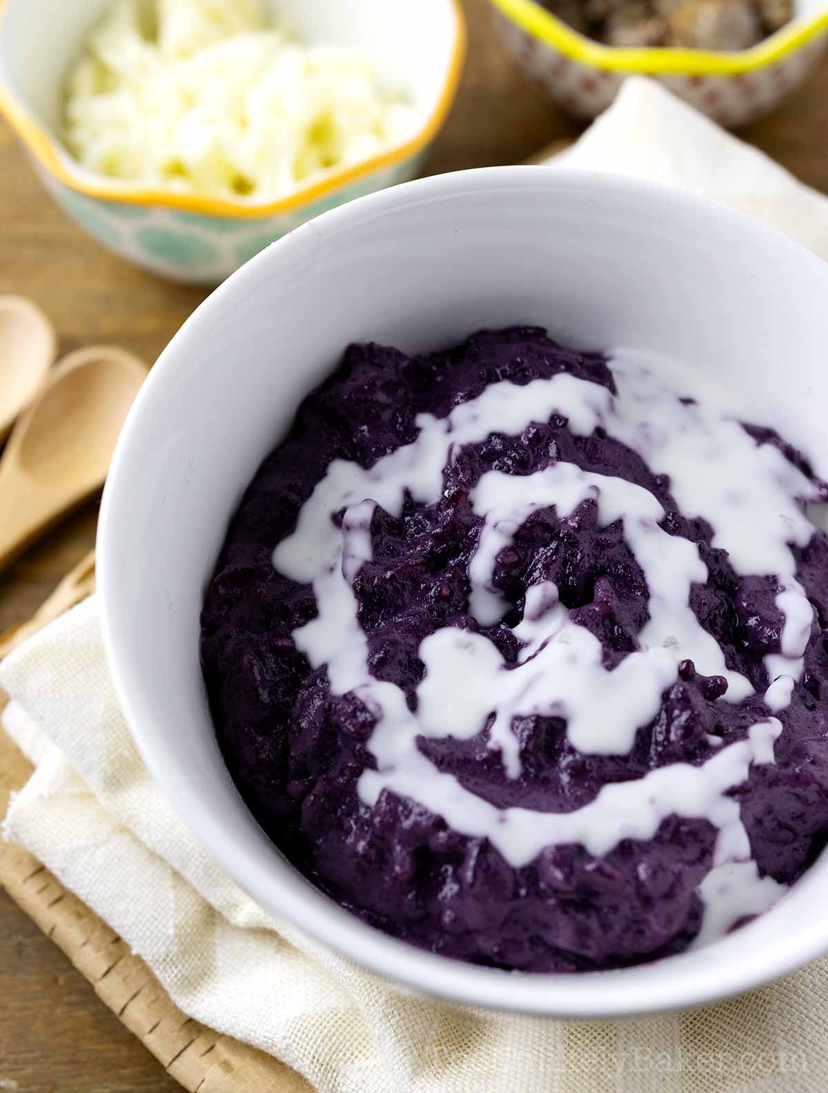 Creamy ube champorado in a bowl.